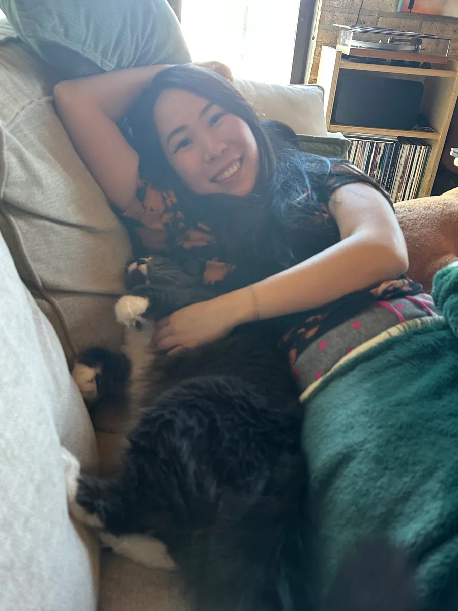Lying down with Zuko the cat